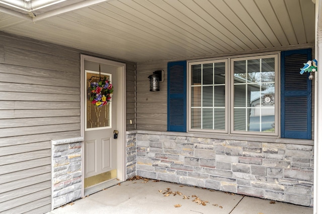553 Cedar Ct, Taylors Falls, MN 55084 - doorway to property featuring stone siding