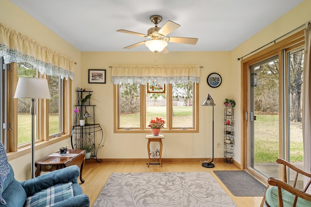 553 Cedar Ct, Taylors Falls, MN 55084 - living area with wood finished floors, a ceiling fan, and baseboards
