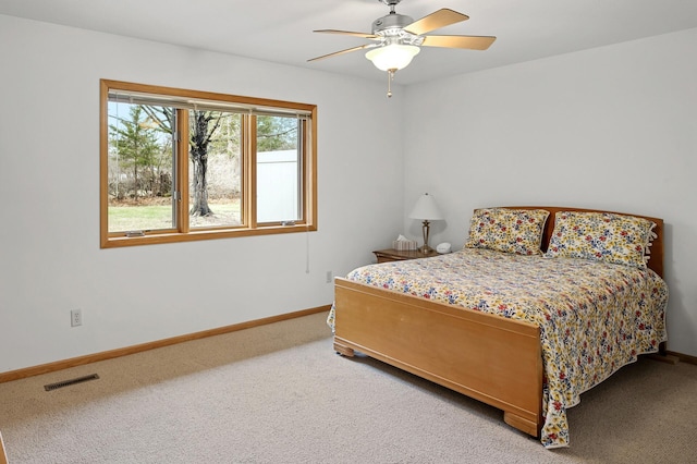 553 Cedar Ct, Taylors Falls, MN 55084 - bedroom with visible vents, carpet flooring, baseboards, and ceiling fan