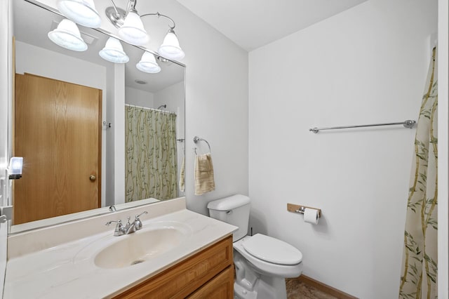 553 Cedar Ct, Taylors Falls, MN 55084 - bathroom with vanity, curtained shower, a notable chandelier, and toilet