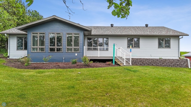 42871 Lida View Ln, Lida Twp, MN 56587 - back of house featuring a shingled roof, a yard, and a wooden deck