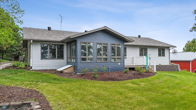 42871 Lida View Ln, Lida Twp, MN 56587 - back of property with a lawn, a deck, and a shingled roof