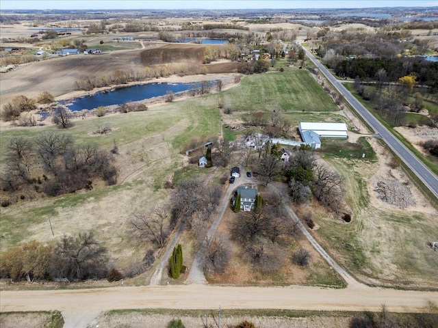 drone / aerial view featuring a water view and a rural view