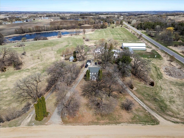birds eye view of property with a water view and a rural view