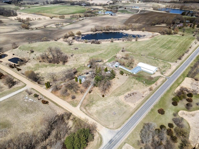 drone / aerial view with a water view and a rural view