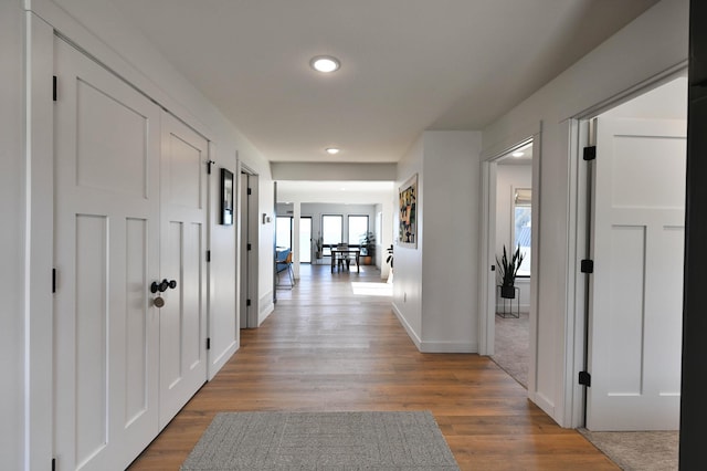 1011 Burgs Park Dr, Shell Lake, WI 54871 - hall featuring baseboards, wood finished floors, and recessed lighting