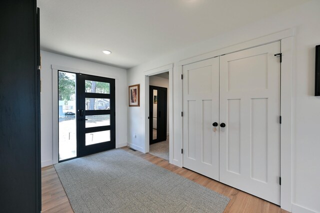 1011 Burgs Park Dr, Shell Lake, WI 54871 - entrance foyer featuring baseboards, light wood-style floors, and recessed lighting