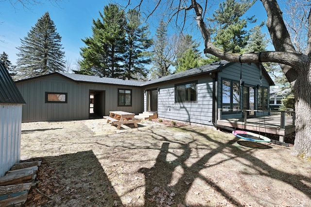 1011 Burgs Park Dr, Shell Lake, WI 54871 - rear view of house featuring entry steps, a patio, and a deck