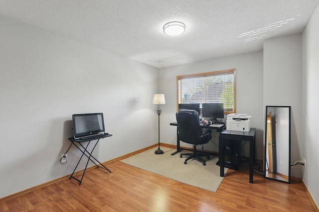 8397 Corcoran Cir Unit 26, Inver Grove Heights, MN 55076 - office area featuring wood finished floors, a textured ceiling, and baseboards