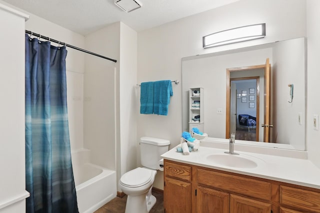 8397 Corcoran Cir Unit 26, Inver Grove Heights, MN 55076 - bathroom featuring toilet, vanity, and shower / bath combo with shower curtain