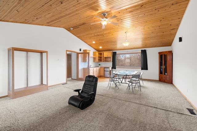 dining room featuring lofted ceiling, light carpet, and wood ceiling