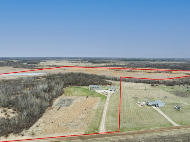 birds eye view of property featuring a rural view