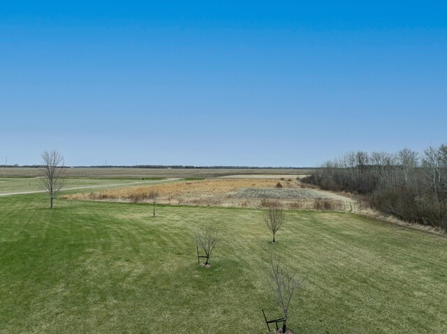 view of yard with a rural view