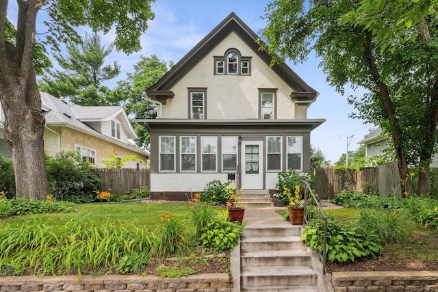 3304 Longfellow Ave, Minneapolis, MN 55407 - view of front facade featuring fence and stucco siding