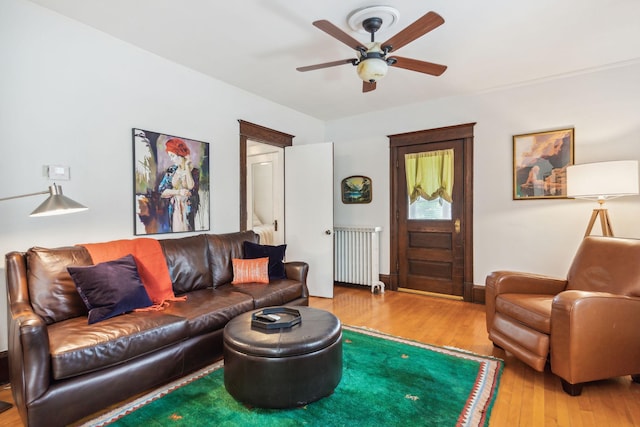 3304 Longfellow Ave, Minneapolis, MN 55407 - living room featuring radiator heating unit, hardwood / wood-style floors, and a ceiling fan