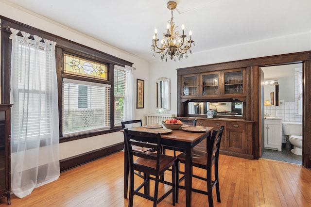 3304 Longfellow Ave, Minneapolis, MN 55407 - dining room with a chandelier and light wood finished floors