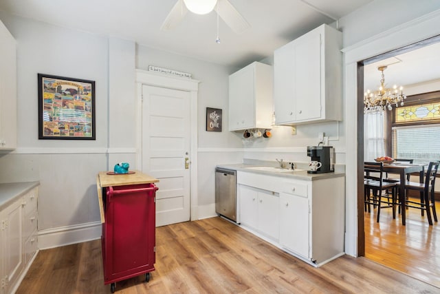 3304 Longfellow Ave, Minneapolis, MN 55407 - kitchen with stainless steel dishwasher, a sink, and light wood-style flooring