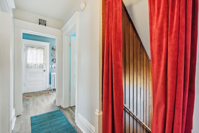 3304 Longfellow Ave, Minneapolis, MN 55407 - hallway featuring radiator, visible vents, wood finished floors, and baseboards