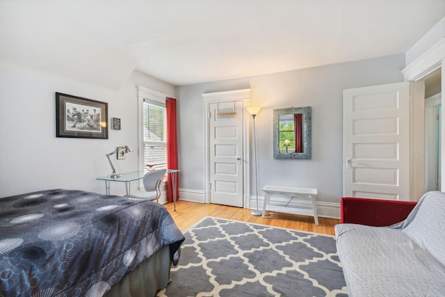 3304 Longfellow Ave, Minneapolis, MN 55407 - bedroom with baseboards, wood finished floors, and a closet
