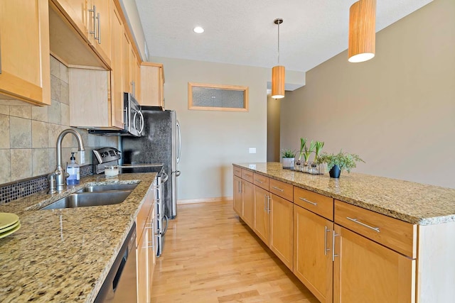 240 Spring St Unit 413, Saint Paul, MN 55102 - kitchen featuring a sink, electric stove, stainless steel microwave, decorative backsplash, and light wood-style floors