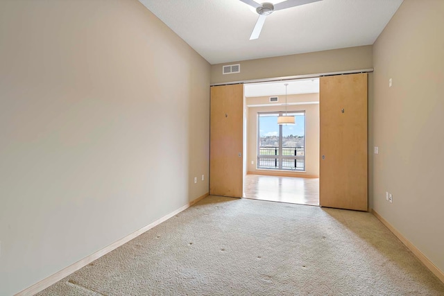 240 Spring St Unit 413, Saint Paul, MN 55102 - carpeted empty room with baseboards and a ceiling fan
