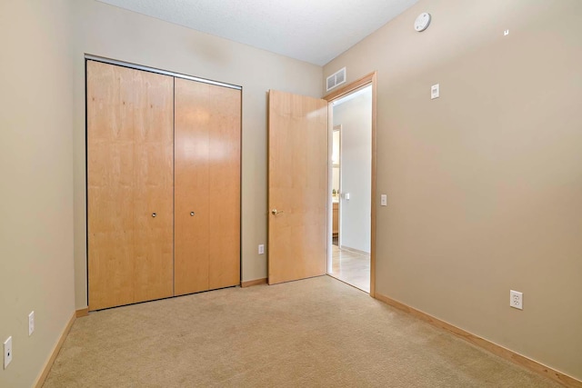 240 Spring St Unit 413, Saint Paul, MN 55102 - unfurnished bedroom with a closet, carpet floors, and baseboards
