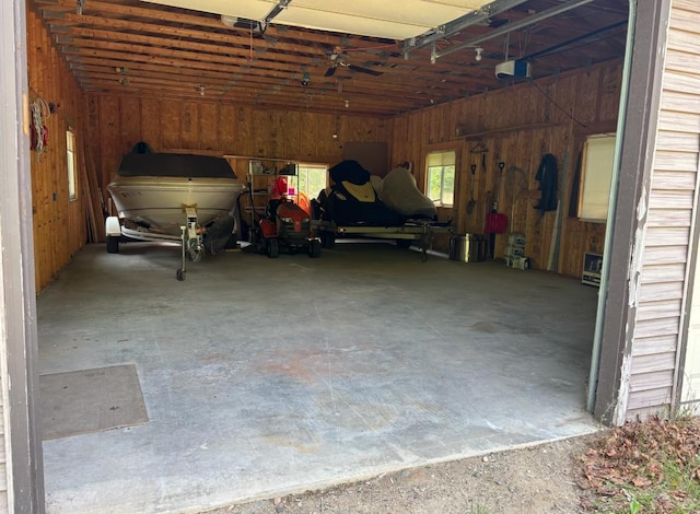 41820 Bald Eagle Dr, Marcell Twp, MN 56628 - garage with wood walls and a garage door opener