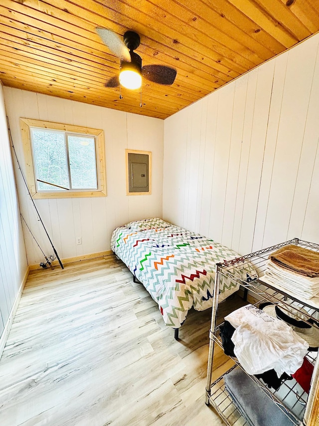 41820 Bald Eagle Dr, Marcell Twp, MN 56628 - bedroom featuring light wood-type flooring, electric panel, wooden ceiling, and ceiling fan