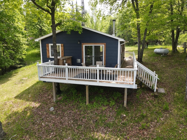 41820 Bald Eagle Dr, Marcell Twp, MN 56628 - back of property with a wooden deck and a yard
