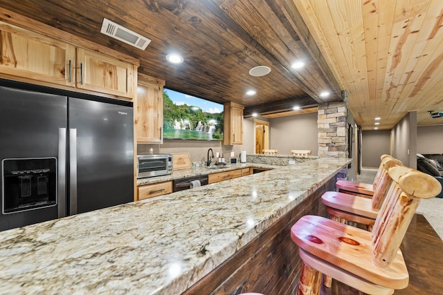 kitchen featuring a sink, wood ceiling, stainless steel refrigerator with ice dispenser, dishwasher, and light brown cabinetry