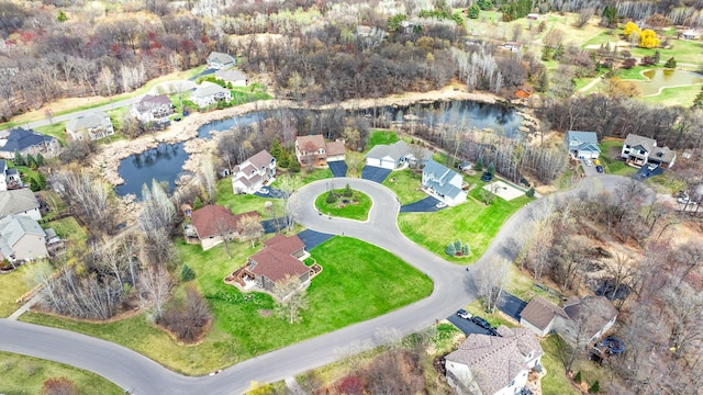 view of property location with nearby suburban area and a nearby body of water