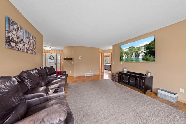 living room with wood finished floors and baseboards