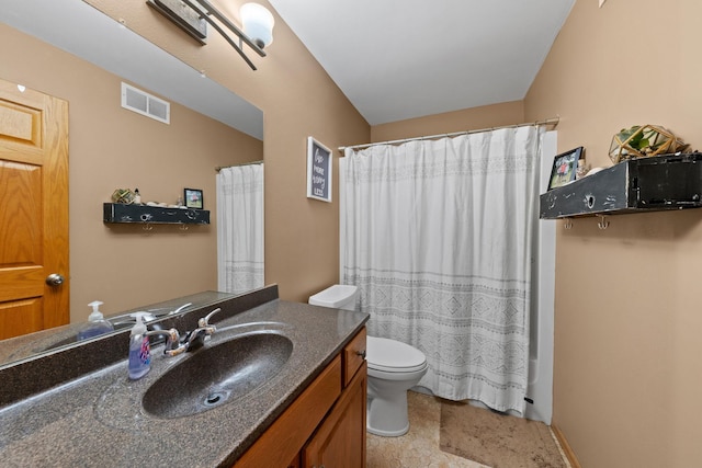 bathroom featuring toilet, vanity, and a shower with shower curtain