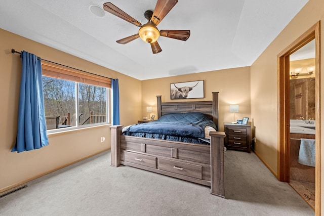 carpeted bedroom with baseboards and ceiling fan