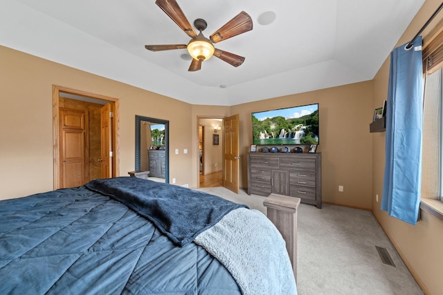 bedroom featuring light carpet, baseboards, and a ceiling fan