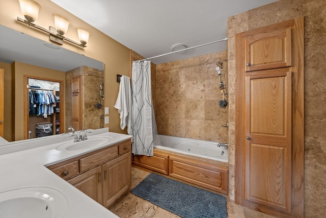 full bathroom with a combined bath / shower with jetted tub, vanity, and a spacious closet