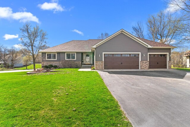 ranch-style house featuring an attached garage, driveway, a front yard, brick siding, and a shingled roof