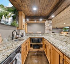 19390 Queen Cir NW, Elk River, MN 55330 - kitchen with wooden ceiling, a sink, dishwasher, recessed lighting, and light stone counters