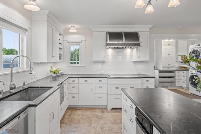 9730 177th Ave SE, Fairmount, ND 58030 - kitchen with wall chimney range hood, a sink, dishwasher, white cabinets, and washer / clothes dryer