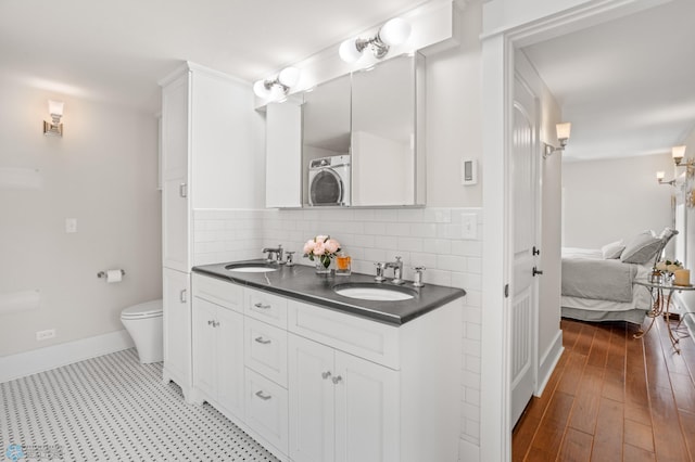 9730 177th Ave SE, Fairmount, ND 58030 - full bath with double vanity, ensuite bath, washer / clothes dryer, and a sink