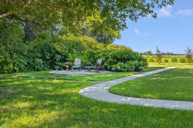 9730 177th Ave SE, Fairmount, ND 58030 - surrounding community with a patio area and a lawn