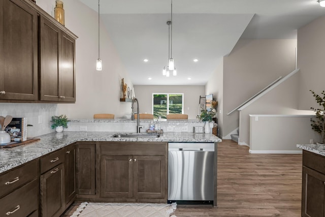 5928 Th St W, Lakeville, MN 55044 - kitchen featuring stainless steel dishwasher, a sink, a peninsula, light wood-type flooring, and dark brown cabinets