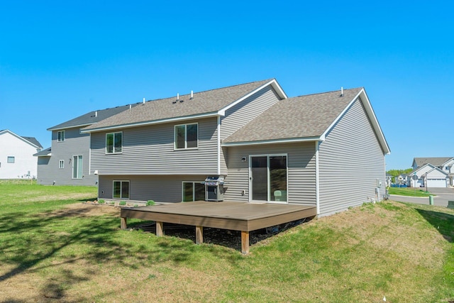 5928 Th St W, Lakeville, MN 55044 - back of house featuring a deck, a yard, and roof with shingles