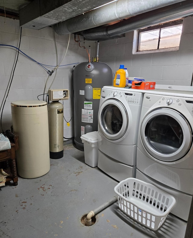 218 Lake Ave E, Fulda, MN 56131 - laundry area featuring water heater, washing machine and dryer, and concrete block wall
