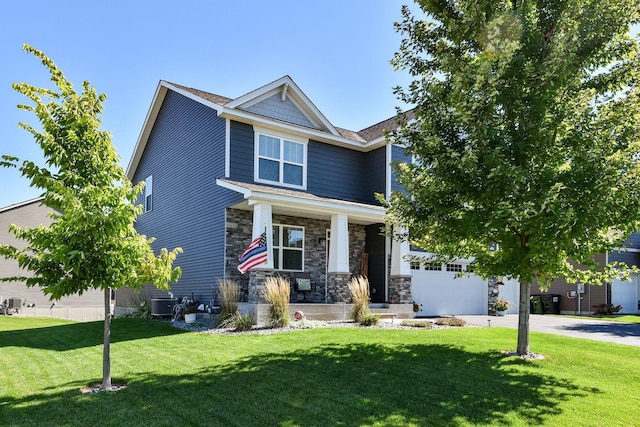craftsman-style house with concrete driveway, a front lawn, stone siding, a porch, and a garage