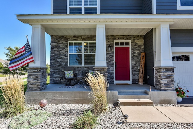 property entrance with stone siding and covered porch
