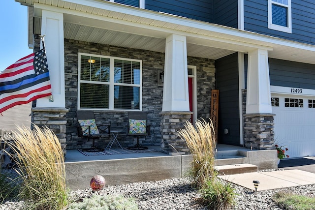 property entrance with stone siding and covered porch