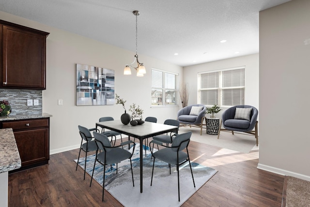 dining area featuring baseboards, recessed lighting, and dark wood finished floors