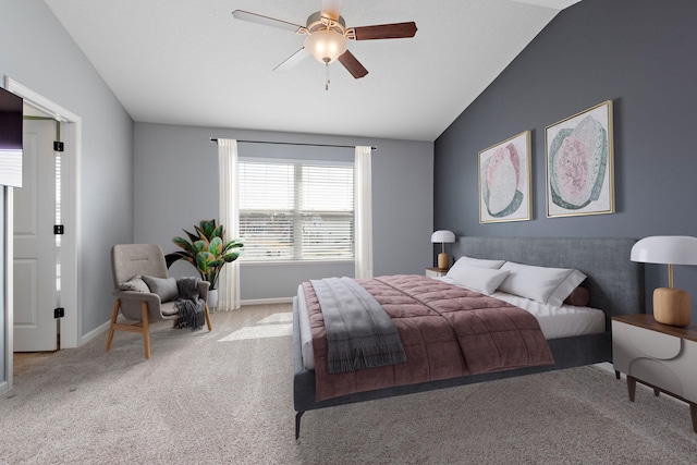 carpeted bedroom with vaulted ceiling, baseboards, and a ceiling fan