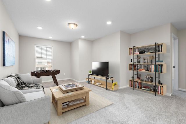 living area featuring recessed lighting, carpet floors, and baseboards